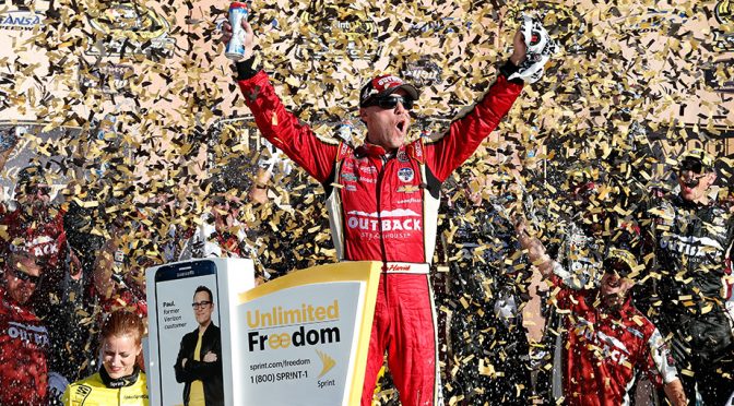 Harvick wins at Kansas, clinches spot in Round of 8
