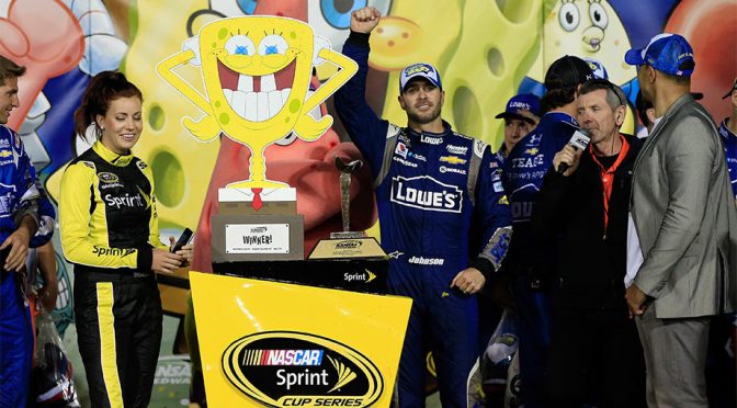 Johnson holds off Harvick for Kansas win