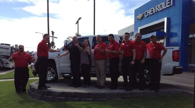 Fan celebrates sweepstakes win, new Chevy