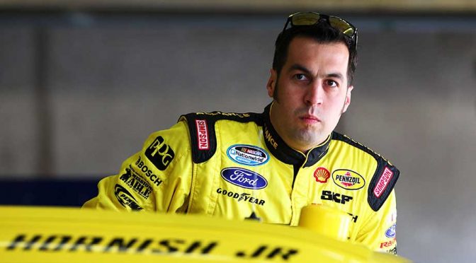 Hornish holds on after wreck