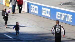 Clint Bowyer's son Cash runs toward him.