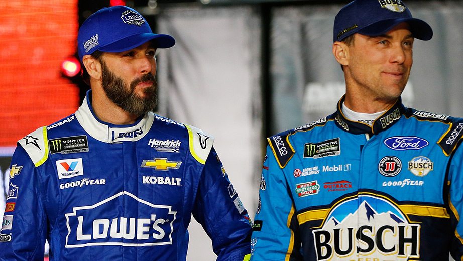 Jimmie Johnson and Kevin Harvick stand next to each other
