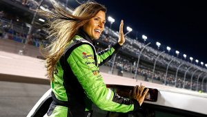 Danica Patrick waves to the crowd at Daytona International Speedway.