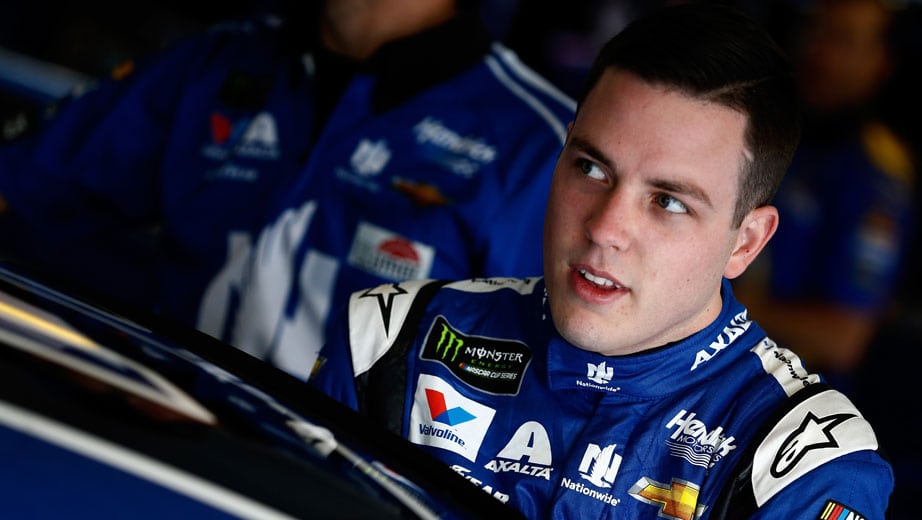 Alex Bowman gets into his car in the garage.