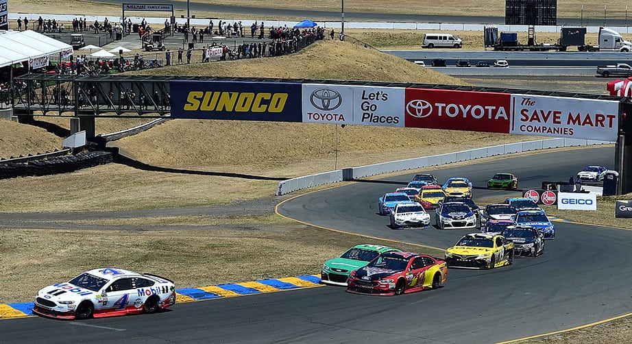 Kevin Harvick, driver of the No. 4 Mobil 1 Ford, leads a pack of cars