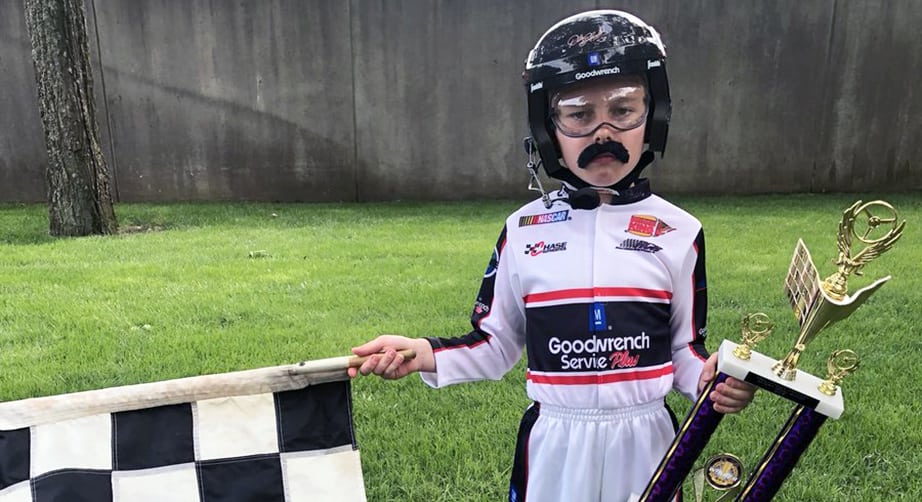 A child dressed up as Dale Earnhardt.