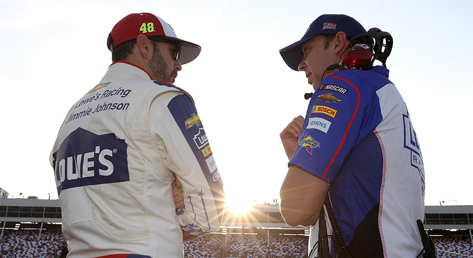 CHARLOTTE, NC - MAY 24: Jimmie Johnson, driver of the #48 Lowe's Patriotic Chevrolet, stands on the grid with crew chief, Chad Knaus, during qualifying for the Monster Energy NASCAR Cup Series Coca-Cola 600 at Charlotte Motor Speedway on May 24, 2018 in Charlotte, North Carolina.  (Photo by Streeter Lecka/Getty Images) | Getty Images