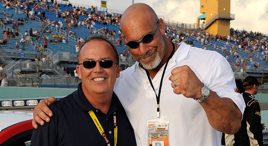 Goldberg takes in a NASCAR race.
