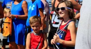 Kids walk through the garage at Iowa Speedway