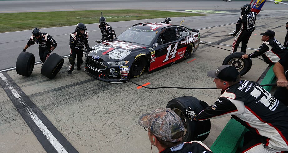 Clint Bowyer gets the No. 14 car serviced during a pit stop at Kentucky.