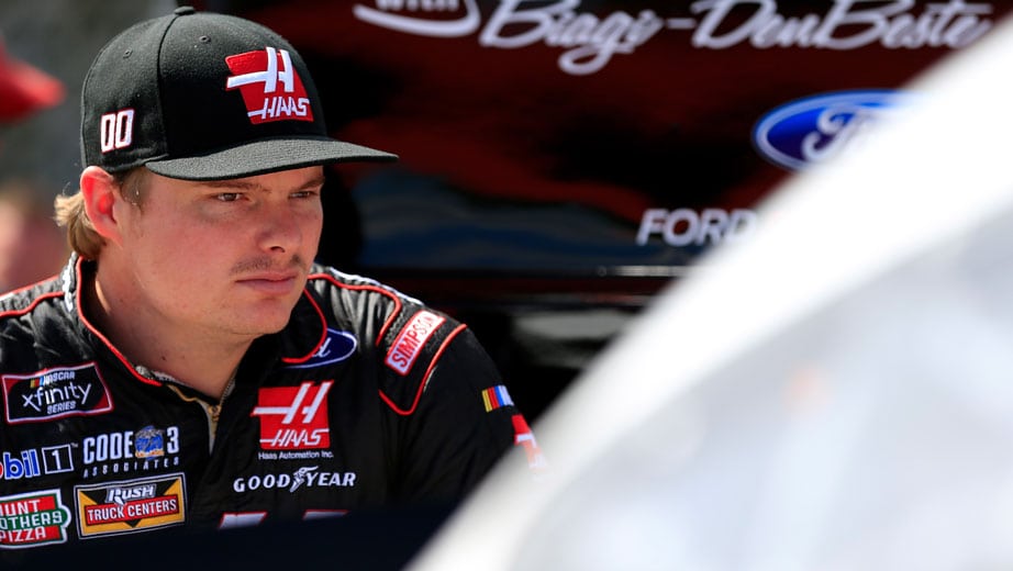 Cole Custer looks on from the garage.