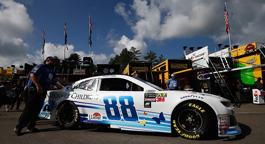 Alex Bowman's car is pushed in the garage area at Watkins Glen.