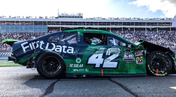 Featured image for Kyle Larson survives late chaos, pushing mangled car to Round of 12