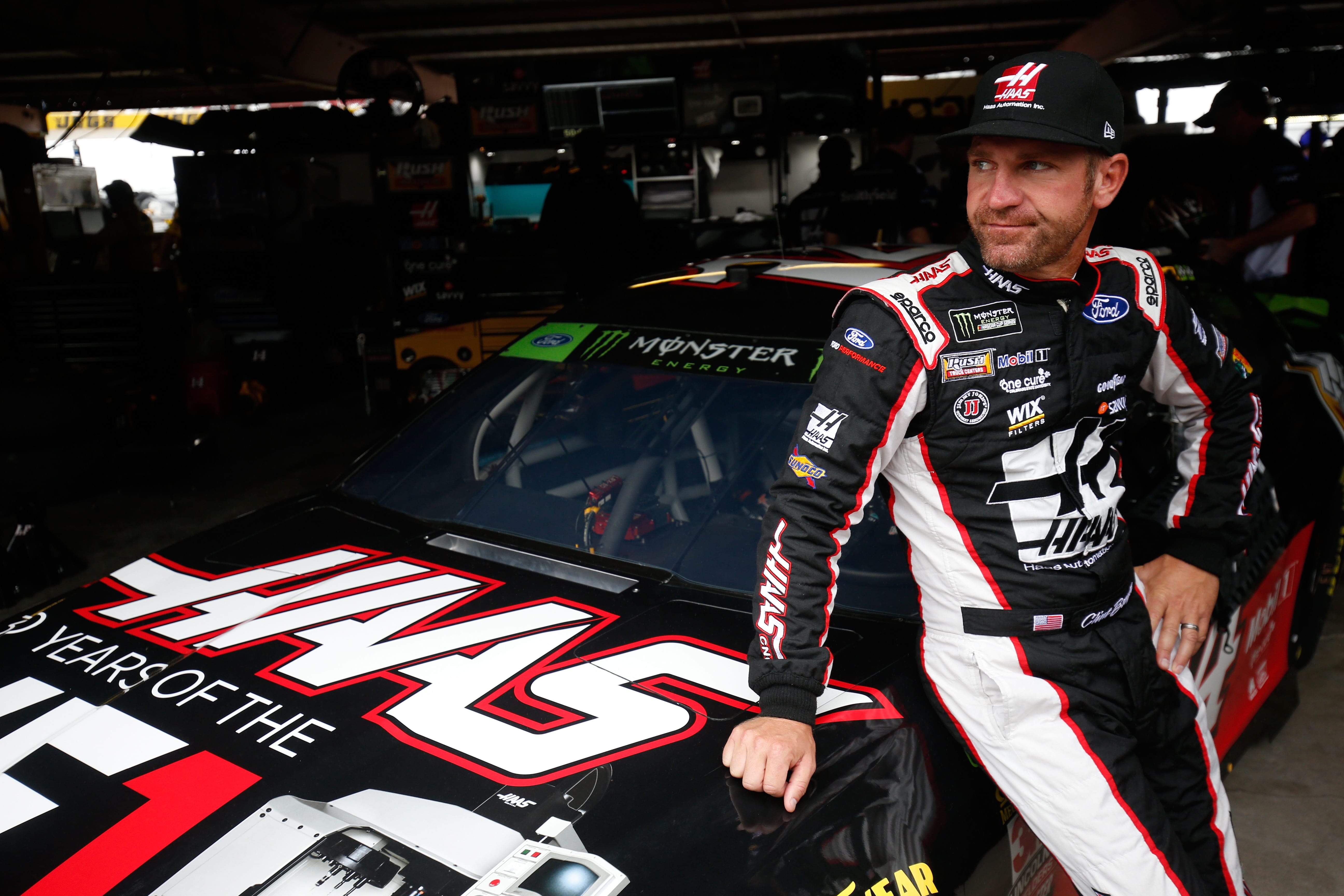 DOVER, DE - OCTOBER 06:  Clint Bowyer, driver of the #14 Haas VF1/Rush Truck Centers Ford, stands in the garage area during practice for the Monster Energy NASCAR Cup Series Gander Outdoors 400 at Dover International Speedway on October 6, 2018 in Dover, Delaware.  (Photo by Chris Trotman/Getty Images) | Getty Images
