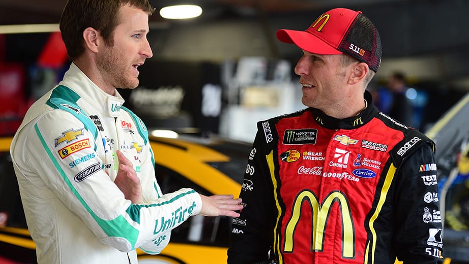MARTINSVILLE, VA - OCTOBER 28:  Kasey Kahne, driver of the #5 UniFirst Chevrolet, talks with Jamie McMurray, driver of the #1 McDonald's Chevrolet, in the garage area before practice for the Monster Energy NASCAR Cup Series First Data 500 at Martinsville Speedway on October 28, 2017 in Martinsville, Virginia.  (Photo by Jared C. Tilton/Getty Images) | Getty Images