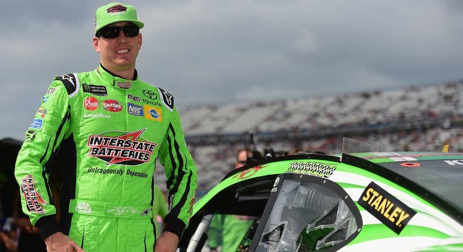 Kyle Busch stands near his car at Dover