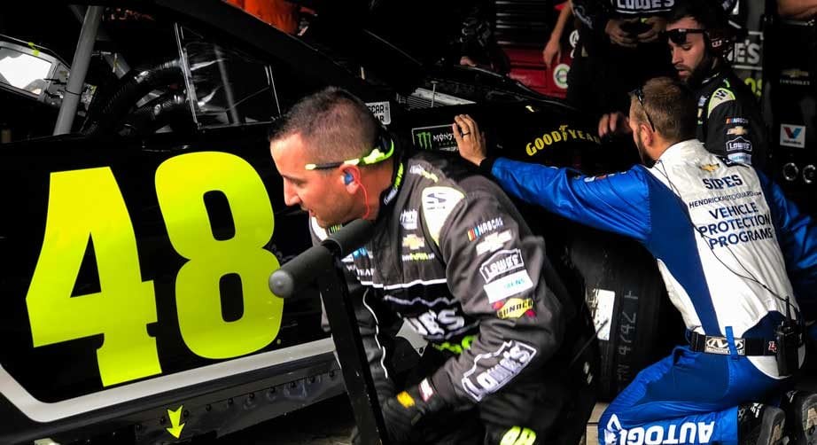 Crew works on Jimmie Johnson's No. 48 in Dover garage