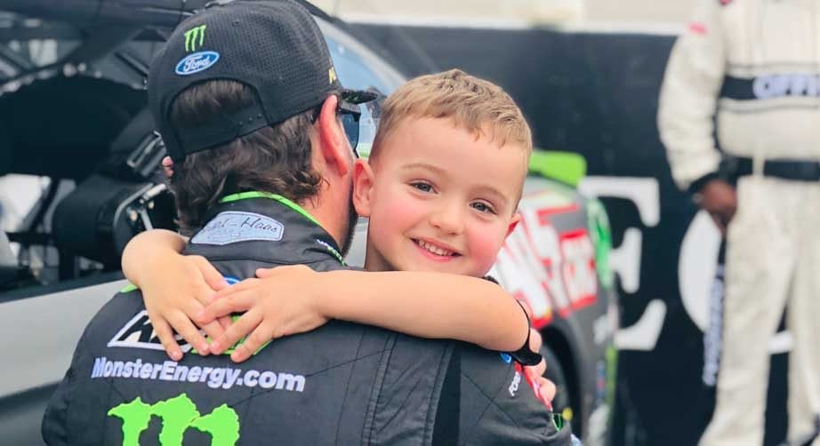 Kurt Busch hugs nephew Brexton at Dover