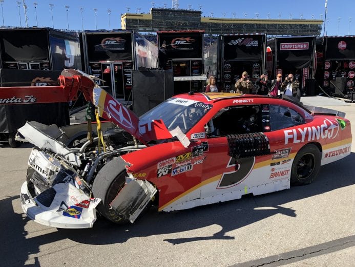 Michael Annett's wrecked No. 5 car is taken back to the garage by the tow truck at Kansas.