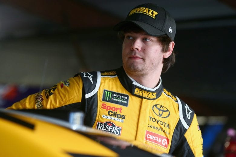 MARTINSVILLE, VA - OCTOBER 27:  Erik Jones, driver of the #20 DeWalt Toyota, stands in the garage area during practice for the Monster Energy NASCAR Cup Series First Data 500 at Martinsville Speedway on October 27, 2018 in Martinsville, Virginia.  (Photo by Sarah Crabill/Getty Images) | Getty Images