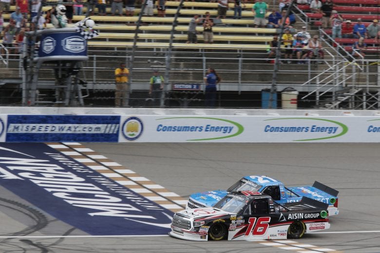BROOKLYN, MI - AUGUST 11: Brett Moffitt, driver of the #16 Hino Toyota, takes the checkered flag before Johnny Sauter, driver of the #21 ISM Connect Chevrolet, during the NASCAR Camping World Truck Series Corrigan Oil 200 at Michigan International Speedway on August 11, 2018 in Brooklyn, Michigan.  (Photo by Jerry Markland/Getty Images) | Getty Images