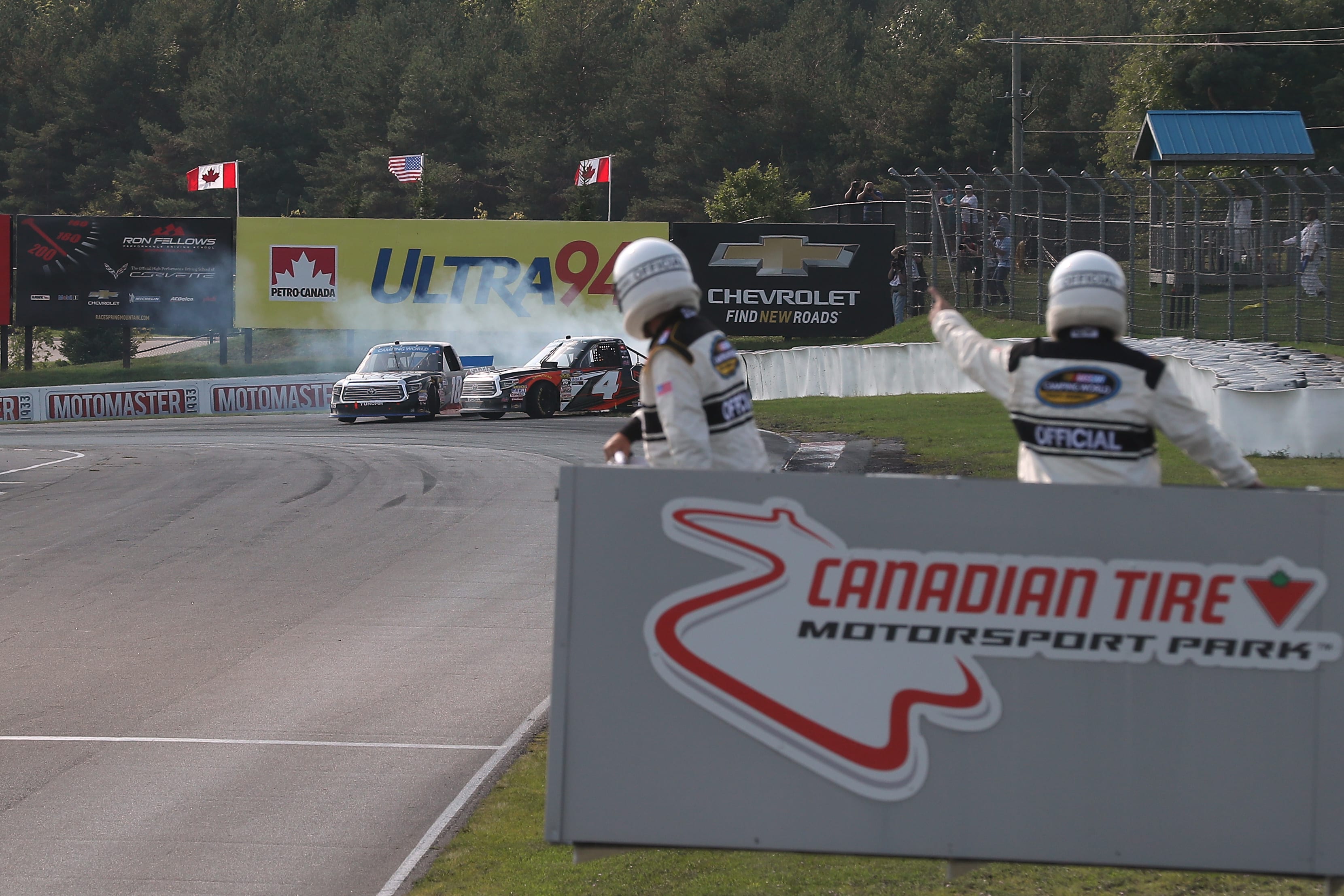 BOWMANVILLE, ON - AUGUST 26: Noah Gragson, driver of the #18 Safelite AutoGlass Toyota, takes out Todd Gilliland, driver of the #4 Frontline Toyota, on the final turn of the final lap as they both spin off the track at Canadian Tire Mosport Park on August 26, 2018 in Bowmanville, Canada. (Photo by Tom Szczerbowski/Getty Images) | Getty Images