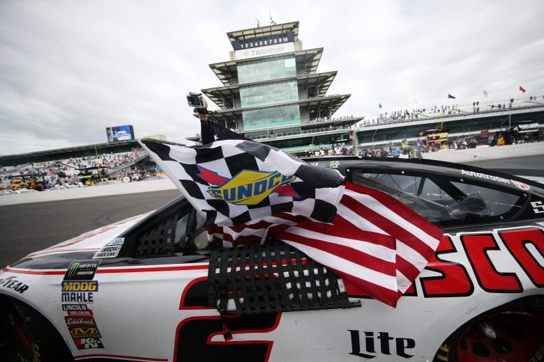 INDIANAPOLIS, IN - SEPTEMBER 10:  Brad Keselowski, driver of the #2 Discount Tire Ford, celebrates after winning the Monster Energy NASCAR Cup Series Big Machine Vodka 400 at the Brickyard at Indianapolis Motor Speedway on September 10, 2018 in Indianapolis, Indiana.  (Photo by Chris Graythen/Getty Images) | Getty Images