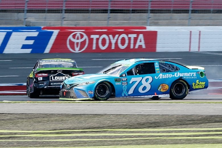 CHARLOTTE, NC - SEPTEMBER 30:  Martin Truex Jr., driver of the #78 Auto-Owners Insurance Toyota, and Jimmie Johnson, driver of the #48 Lowe's for Pros Chevrolet, are involved in an on-track incident on the last lap of the Monster Energy NASCAR Cup Series Bank of America Roval 400 at Charlotte Motor Speedway on September 30, 2018 in Charlotte, North Carolina.  (Photo by Brian Lawdermilk/Getty Images) | Getty Images
