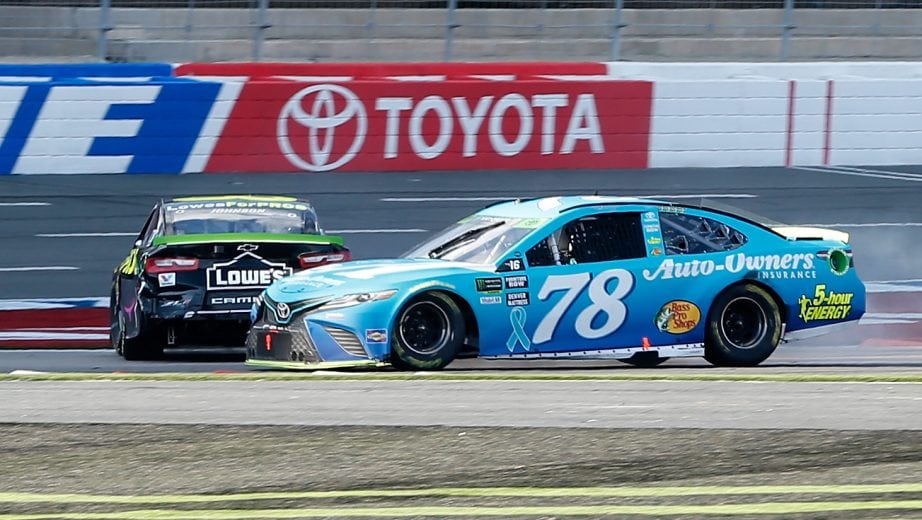 CHARLOTTE, NC - SEPTEMBER 30: Martin Truex Jr., driver of the #78 Auto-Owners Insurance Toyota, and Jimmie Johnson, driver of the #48 Lowe's for Pros Chevrolet, are involved in an on-track incident on the last lap of the Monster Energy NASCAR Cup Series Bank of America Roval 400 at Charlotte Motor Speedway on September 30, 2018 in Charlotte, North Carolina. (Photo by Brian Lawdermilk/Getty Images) | Getty Images