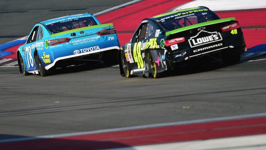 CHARLOTTE, NC - SEPTEMBER 30: Jimmie Johnson, driver of the #48 Lowe's for Pros Chevrolet, races Martin Truex Jr., driver of the #78 Auto-Owners Insurance Toyota, during the Monster Energy NASCAR Cup Series Bank of America Roval 400 at Charlotte Motor Speedway on September 30, 2018 in Charlotte, North Carolina. (Photo by Jared C. Tilton/Getty Images) | Getty Images