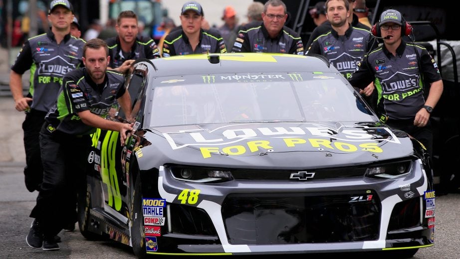 DOVER, DE - OCTOBER 05: Crew members push the #48 Lowe's for Pros Chevrolet, driven by Jimmie Johnson(not pictured), through the garage area during practice for the Monster Energy NASCAR Cup Series Gander Outdoors 400 at Dover International Speedway on October 5, 2018 in Dover, Delaware. (Photo by Chris Trotman/Getty Images) | Getty Images