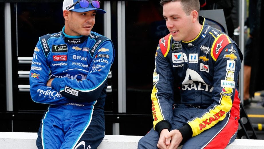 DOVER, DE - OCTOBER 05: Kyle Larson, driver of the #42 Credit One Bank Chevrolet, speaks with Alex Bowman, driver of the #88 Axalta Chevrolet, on the grid during qualifying for the Monster Energy NASCAR Cup Series Gander Outdoors 400 at Dover International Speedway on October 5, 2018 in Dover, Delaware. (Photo by Brian Lawdermilk/Getty Images) | Getty Images