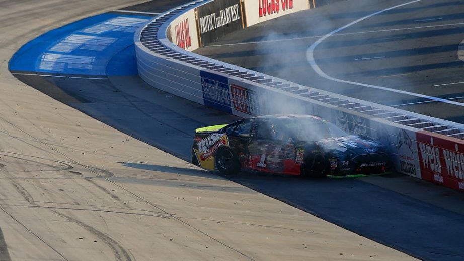 DOVER, DE - OCTOBER 07: Clint Bowyer, driver of the #14 Haas VF1/Rush Truck Centers Ford, is involved in an on-track incident during the Monster Energy NASCAR Cup Series Gander Outdoors 400 at Dover International Speedway on October 7, 2018 in Dover, Delaware. (Photo by Chris Trotman/Getty Images) | Getty Images