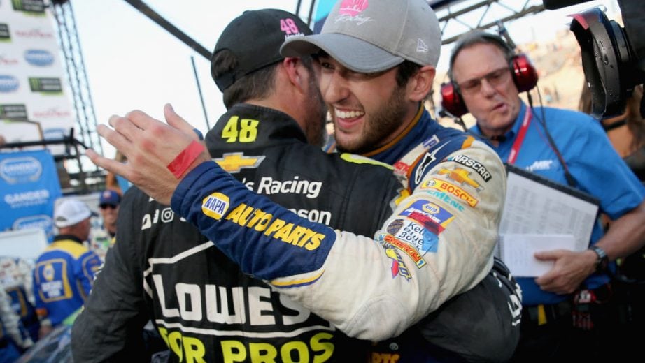 DOVER, DE - OCTOBER 07: Chase Elliott, driver of the #9 NAPA Auto Parts Chevrolet, is congratulated by Jimmie Johnson, driver of the #48 Lowe's for Pros Chevrolet, in Victory Lane after winning the Monster Energy NASCAR Cup Series Gander Outdoors 400 at Dover International Speedway on October 7, 2018 in Dover, Delaware. (Photo by Brian Lawdermilk/Getty Images) | Getty Images