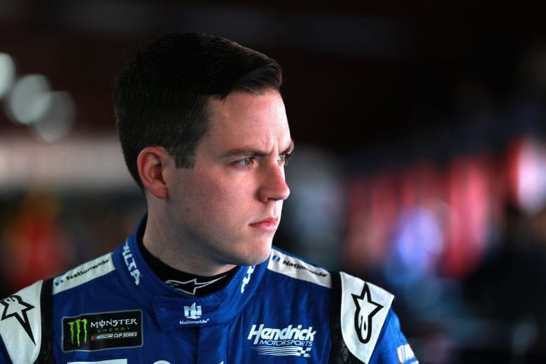 TALLADEGA, AL - OCTOBER 13:  Alex Bowman, driver of the #88 Nationwide Chevrolet, stands in the garage during practice for the Monster Energy NASCAR Cup Series 1000Bulbs.com 500 at Talladega Superspeedway on October 13, 2018 in Talladega, Alabama.  (Photo by Sean Gardner/Getty Images) | Getty Images
