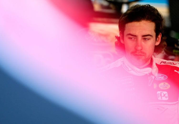 TALLADEGA, AL - OCTOBER 13:  Ryan Blaney, driver of the #12 REV Ford, stands in the garage during practice for the Monster Energy NASCAR Cup Series 1000Bulbs.com 500 at Talladega Superspeedway on October 13, 2018 in Talladega, Alabama.  (Photo by Brian Lawdermilk/Getty Images) | Getty Images