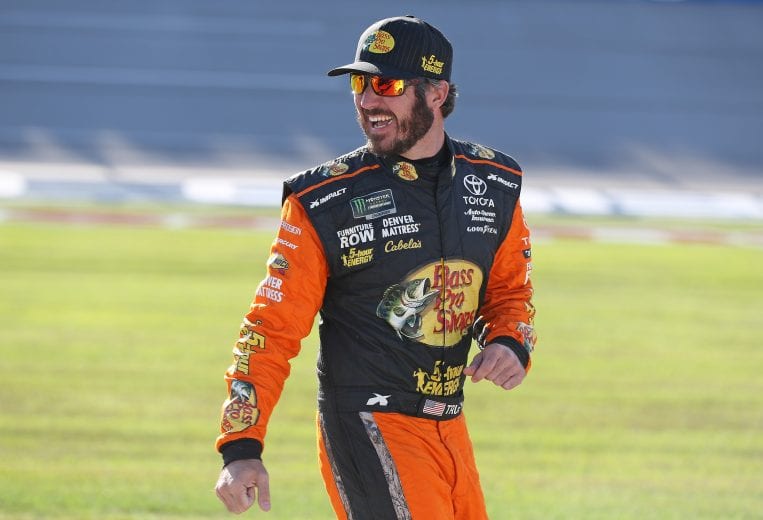 TALLADEGA, AL - OCTOBER 13:  Martin Truex Jr., driver of the #78 Bass Pro Shops/5-hour ENERGY Toyota, walks to his car during qualifying for the Monster Energy NASCAR Cup Series 1000Bulbs.com 500 at Talladega Superspeedway on October 13, 2018 in Talladega, Alabama.  (Photo by Matt Sullivan/Getty Images) | Getty Images