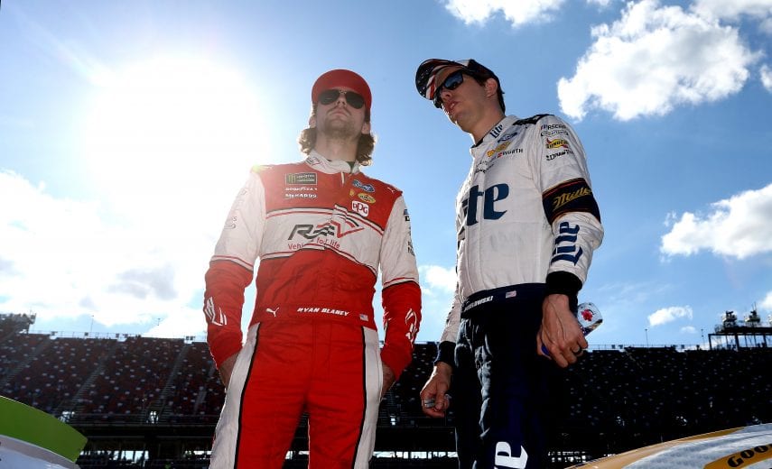 TALLADEGA, AL - OCTOBER 13:  Ryan Blaney, driver of the #12 REV Ford, talks with Brad Keselowski, driver of the #2 Miller Lite Ford, during qualifying for the Monster Energy NASCAR Cup Series 1000Bulbs.com 500 at Talladega Superspeedway on October 13, 2018 in Talladega, Alabama.  (Photo by Brian Lawdermilk/Getty Images) | Getty Images