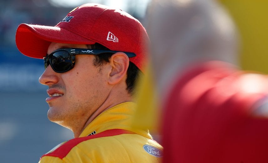 TALLADEGA, AL - OCTOBER 13: Joey Logano, driver of the #22 Shell Pennzoil Ford, stands by his car during qualifying for the Monster Energy NASCAR Cup Series 1000Bulbs.com 500 at Talladega Superspeedway on October 13, 2018 in Talladega, Alabama. (Photo by Brian Lawdermilk/Getty Images) | Getty Images