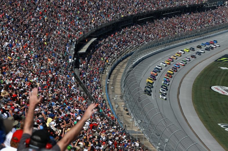 TALLADEGA, AL - OCTOBER 14:  Kurt Busch, driver of the #41 Monster Energy/Haas Automation Ford, and Clint Bowyer, driver of the #14 Cummins/Rush Truck Centers Ford, lead the field to the green flag to start the Monster Energy NASCAR Cup Series 1000Bulbs.com 500 at Talladega Superspeedway on October 14, 2018 in Talladega, Alabama.  (Photo by Sean Gardner/Getty Images) | Getty Images