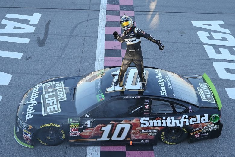 TALLADEGA, AL - OCTOBER 14:  Aric Almirola, driver of the #10 Smithfield Bacon for Life Ford, celebrates after winning the Monster Energy NASCAR Cup Series 1000Bulbs.com 500 at Talladega Superspeedway on October 14, 2018 in Talladega, Alabama.  (Photo by Matt Sullivan/Getty Images) | Getty Images