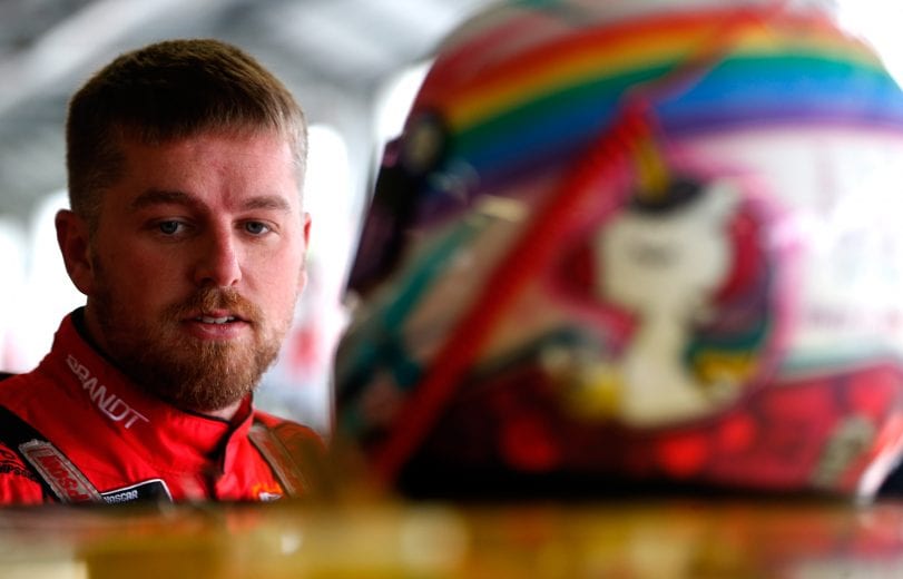 KANSAS CITY, KS - OCTOBER 19:  Justin Allgaier, driver of the #7 BRANDT Professional Agriculture Chevrolet, stands in the garage area during practice for the NASCAR Xfinity Series Kansas Lottery 300 at Kansas Speedway on October 19, 2018 in Kansas City, Kansas.  (Photo by Brian Lawdermilk/Getty Images) | Getty Images