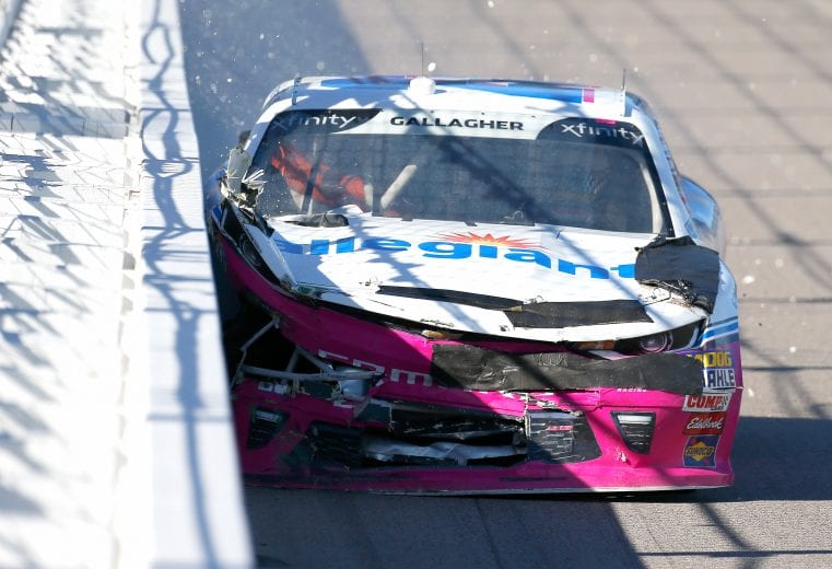 Spencer Gallagher hits the wall in the No. 23 Chevrolet at Kansas.