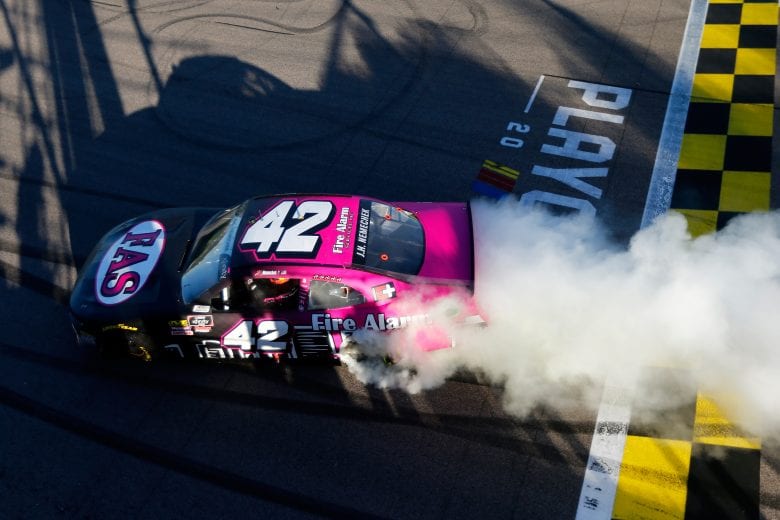 John Hunter Nemechek performs a burnout after winning at Kansas.