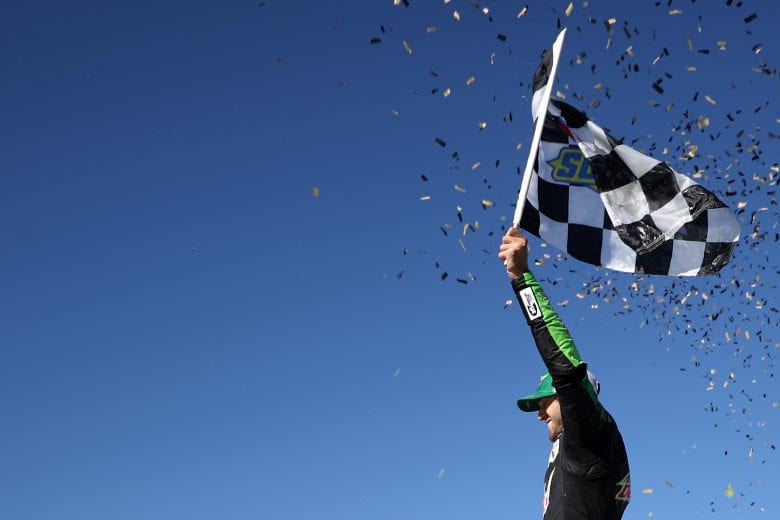KANSAS CITY, KS - OCTOBER 21:  Chase Elliott, driver of the #9 Mountain Dew Chevrolet, celebrates in victory lane after winning the Monster Energy NASCAR Cup Series Hollywood Casino 400 at Kansas Speedway on October 21, 2018 in Kansas City, Kansas.  (Photo by Chris Graythen/Getty Images) | Getty Images