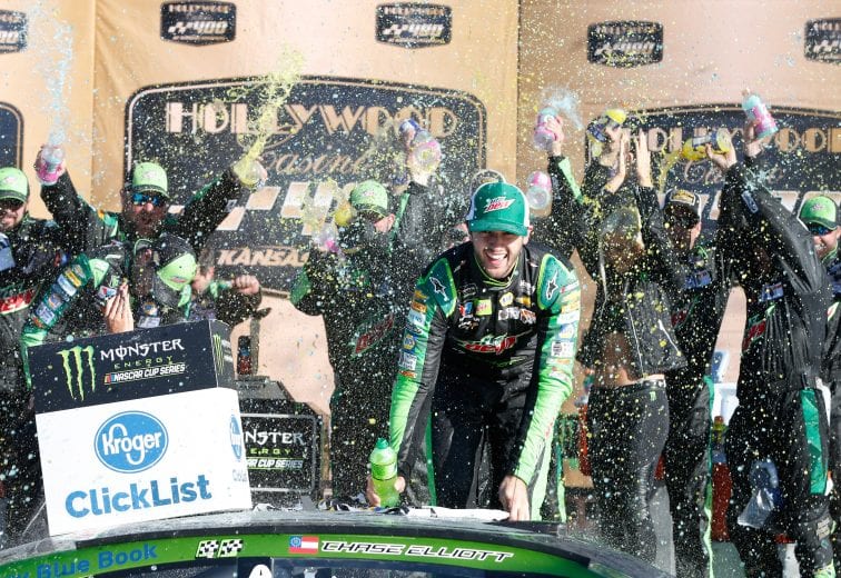 KANSAS CITY, KS - OCTOBER 21:  Chase Elliott, driver of the #9 Mountain Dew Chevrolet, celebrates in victory lane after winning the Monster Energy NASCAR Cup Series Hollywood Casino 400 at Kansas Speedway on October 21, 2018 in Kansas City, Kansas.  (Photo by Brian Lawdermilk/Getty Images) | Getty Images