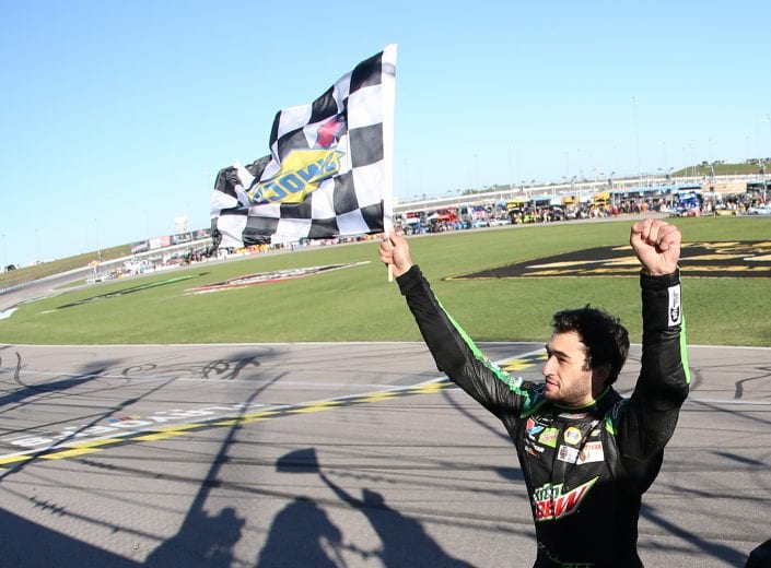 KANSAS CITY, KS - OCTOBER 21:  Chase Elliott, driver of the #9 Mountain Dew Chevrolet, celebrates with the checkered flag after winning the Monster Energy NASCAR Cup Series Hollywood Casino 400 at Kansas Speedway on October 21, 2018 in Kansas City, Kansas.  (Photo by Matt Sullivan/Getty Images) | Getty Images