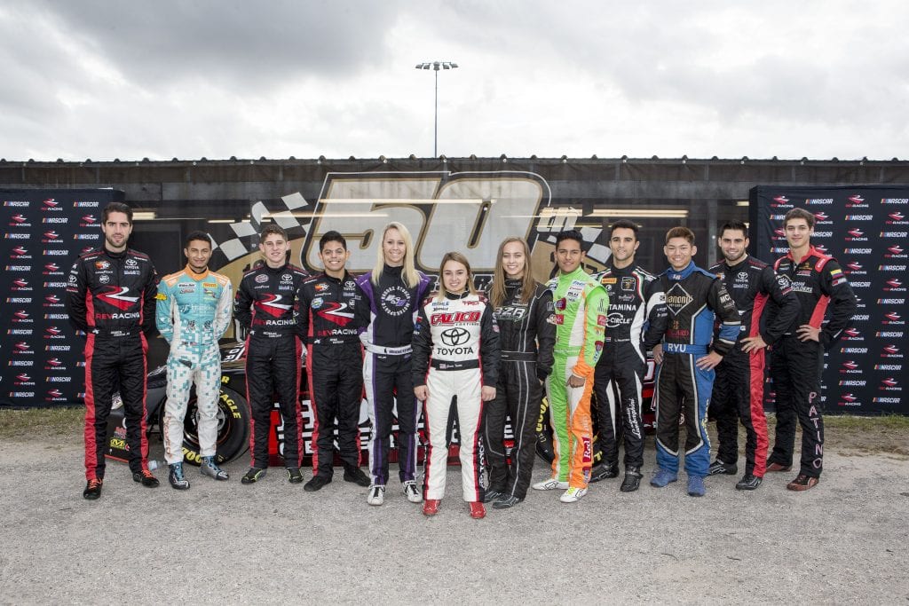 NEW SMYRNA BEACH, FL - OCTOBER 23: Left to right, Ruben Garcia Jr., of Mexico, Ernie Francis Jr., Nick Sanchez, Ryan Vargas, Brooke Storer, Gracie Trotter, Brittney Zamora, Juan Manuel Gonzalez, of Mexico, Loris Hezemans, of the Netherlands, Ryu Taggart, Chase Cabre, and Perry Patino pose for a group shot, NASCAR Drive for Diversity Combine, at New Smyrna Speedway on October 23, 2018 in New Smyrna Beach, Florida. (Photo by Brian Cleary/Getty Images) | Getty Images