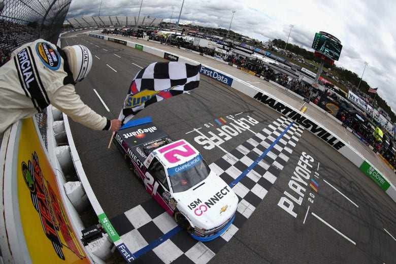 MARTINSVILLE, VA - OCTOBER 27: Johnny Sauter, driver of the #21 ISM Connect Chevrolet, takes the checkered flag to win the NASCAR Camping World Truck Series Texas Roadhouse 200 presented by Alpha Energy Solutions at Martinsville Speedway on October 27, 2018 in Martinsville, Virginia. (Photo by Sarah Crabill/Getty Images) | Getty Images