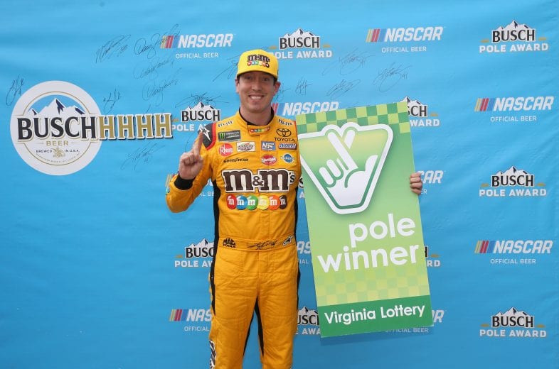 MARTINSVILLE, VA - OCTOBER 27: Kyle Busch, driver of the #18 M&M's Halloween Toyota, poses with the Virginia Lottery Pole Award after posting the fastest lap during qualifying for the Monster Energy NASCAR Cup Series First Data 500 at Martinsville Speedway on October 27, 2018 in Martinsville, Virginia. (Photo by Brian Lawdermilk/Getty Images) | Getty Images